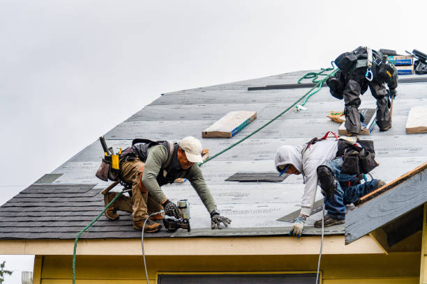 Professional Gutter Installation technician working in Arock, OR